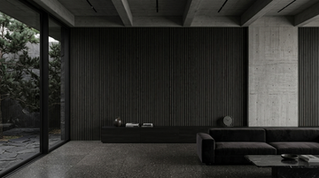 Neo Gray wood slat acoustic panels shown on a living-room feature wall beside a dark sofa.
