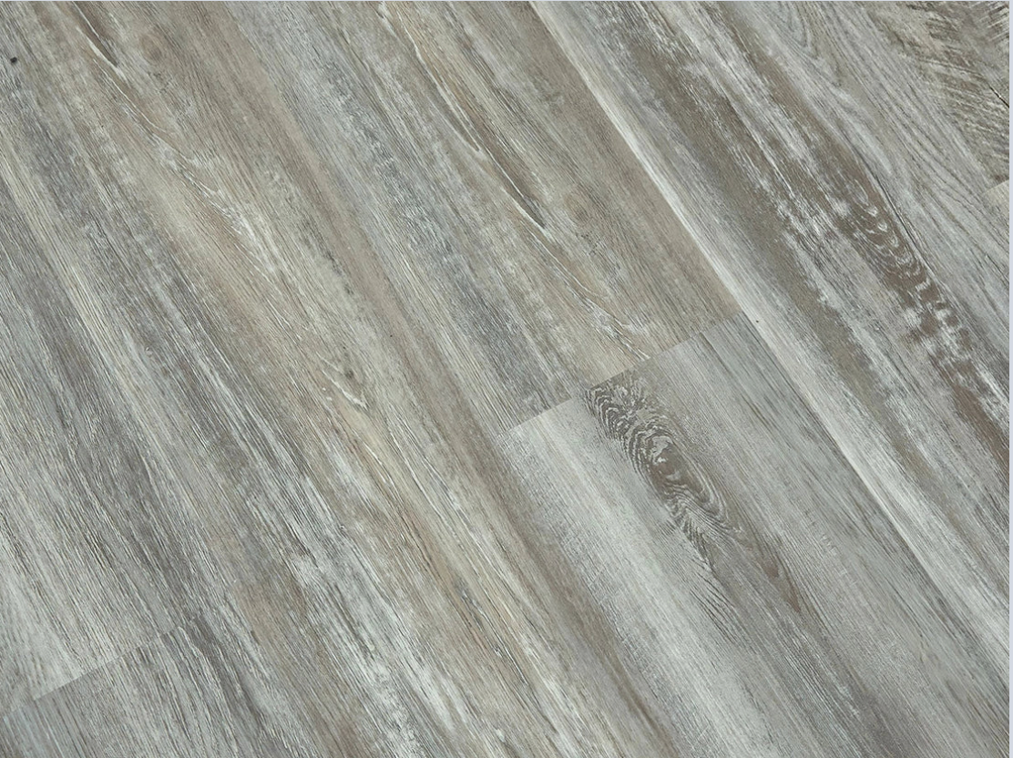 Blizzard SPC vinyl flooring, angled close-up of the grain and plank joints.
