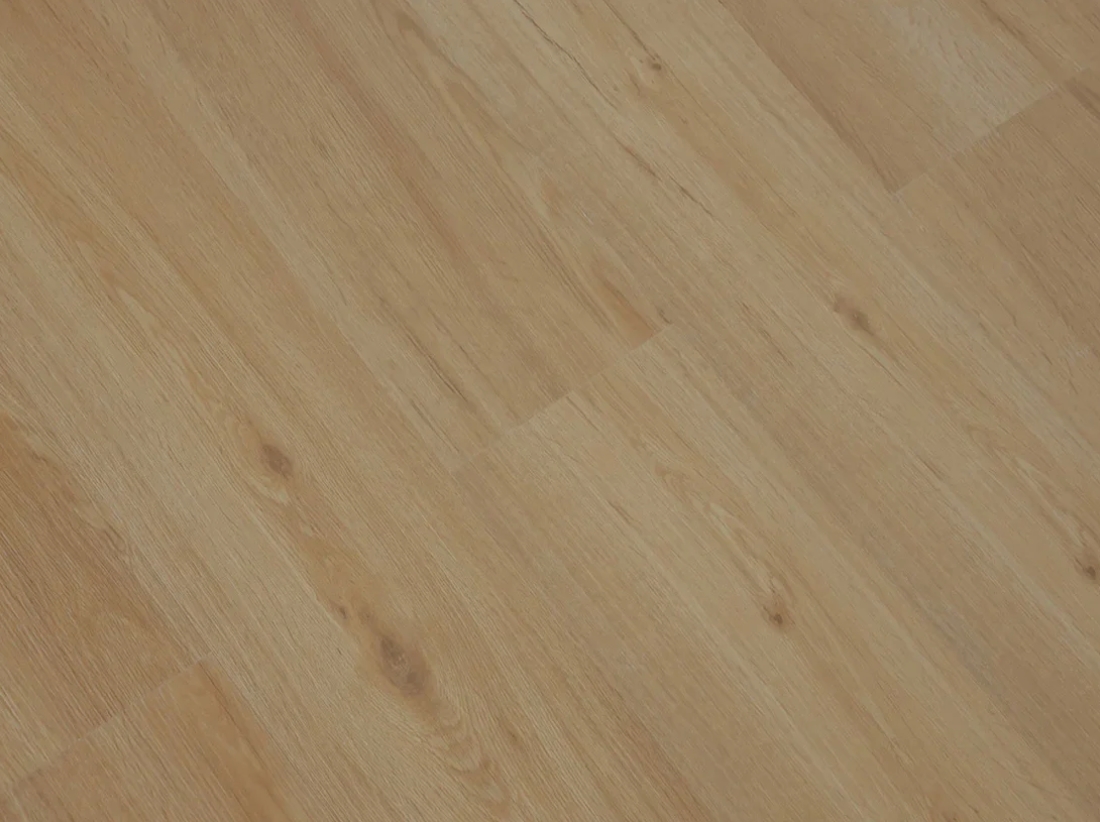 Caramel SPC vinyl flooring, angled close-up of the grain and plank joints.