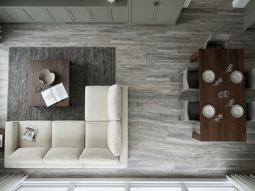Blizzard SPC vinyl flooring, overhead view of a living and dining area with a white sectional sofa.