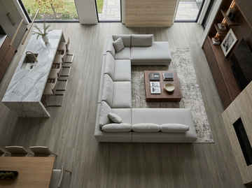 Cathedral SPC vinyl flooring, overhead view of an open kitchen and living area with a sectional sofa.