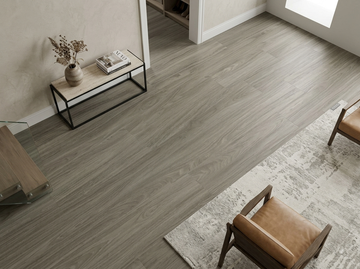 Cathedral SPC vinyl flooring, shown beside a console table and lounge chair.