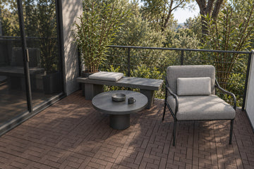 Brown interlocking composite deck tiles in a woodland terrace; AI installation visualization guided by the product’s 3D tile model.