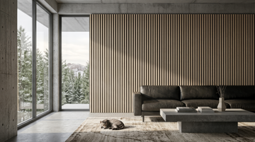 Classic wood slat acoustic panels shown behind a dark sofa in a living room.