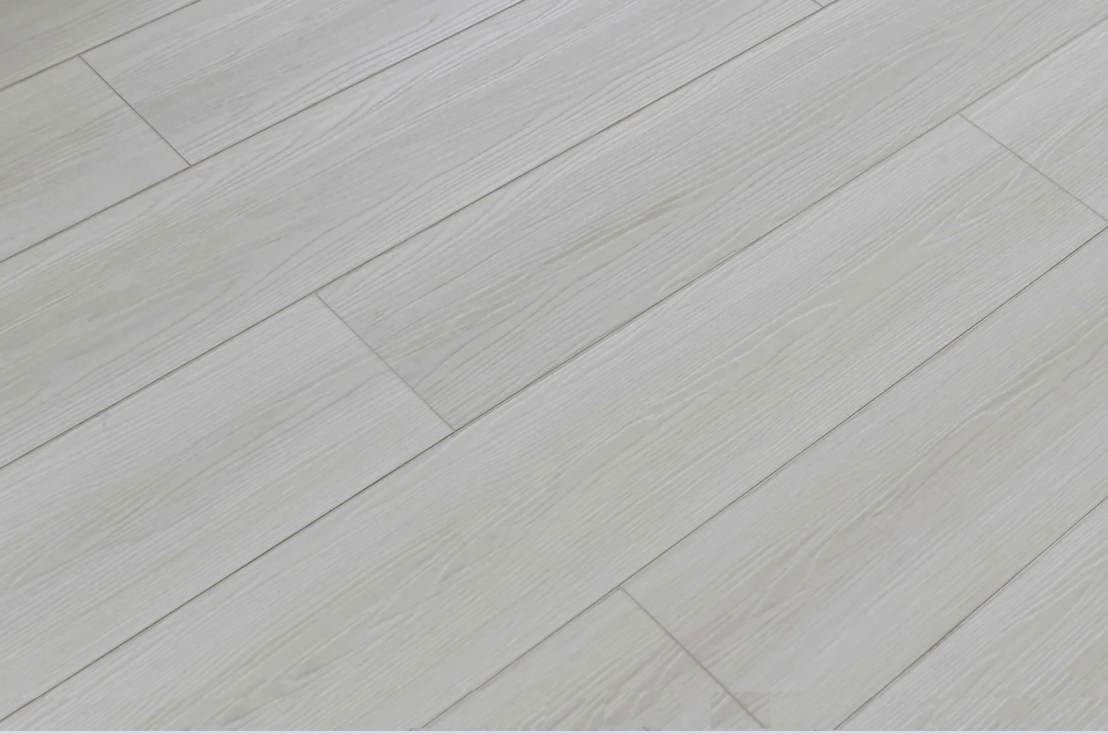 Cornsilk SPC vinyl flooring, angled close-up of the grain and plank joints.