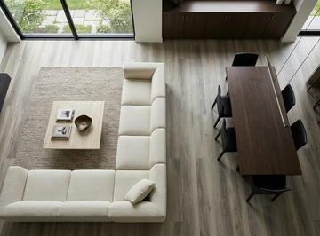 Floating Ice SPC vinyl flooring, overhead view of a living and dining area with a white sectional sofa.