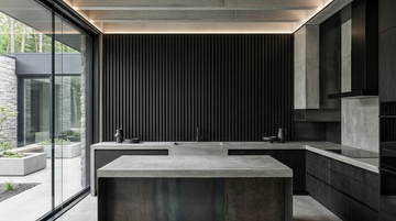 Night wood slat acoustic panels shown behind a kitchen island.