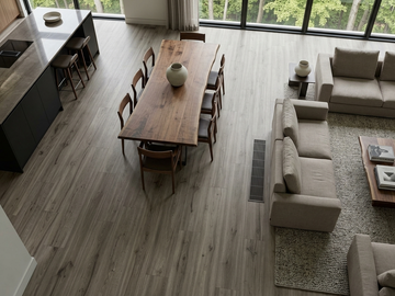 Pebble SPC vinyl flooring, shown in an open living and dining area.