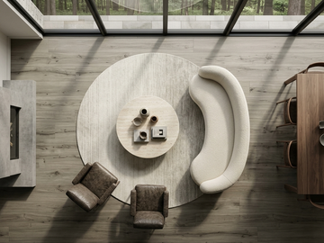 Pebble SPC vinyl flooring, overhead view around a curved sofa and round rug.